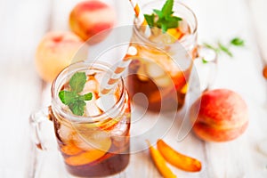 Homemade lemonade with ripe peaches and fresh mint. Fresh peach