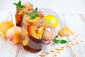 Homemade lemonade with ripe peaches and fresh mint. Fresh peach