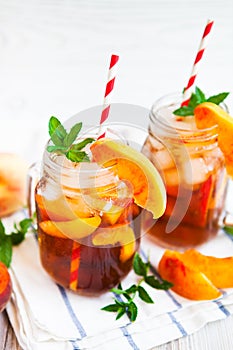 Homemade lemonade with ripe peaches and fresh mint. Fresh peach