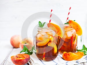 Homemade lemonade with ripe peaches and fresh mint. Fresh peach