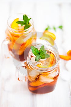 Homemade lemonade with ripe peaches and fresh mint. Fresh peach