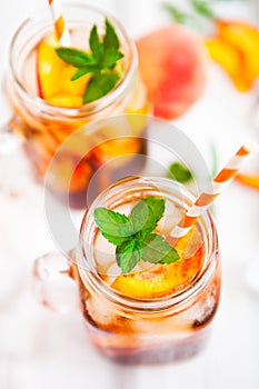 Homemade lemonade with ripe peaches and fresh mint. Fresh peach