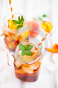 Homemade lemonade with ripe peaches and fresh mint. Fresh peach