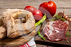 Homemade lepinja bread and appetizer on wooden background photo