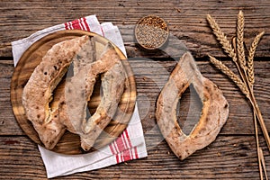 Homemade lepinja bread on wooden background photo