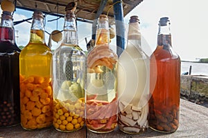 Homemade liqueur in glass bottle at Atins, Brazil