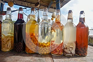 Homemade liqueur in glass bottle at Atins, Brazil