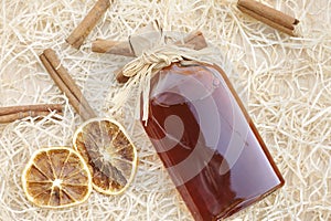 Homemade liqueur with spices photo