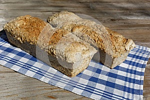 Homemade loaf of bread on kitchen cloth