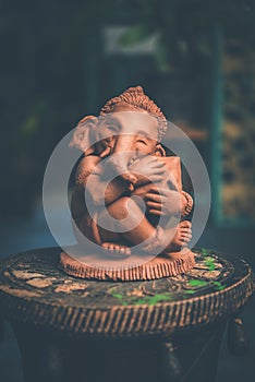 Homemade lord Ganesha idol or Ganapati Bappa murti using dissolvable clay