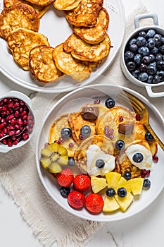 Homemade low calorie curd cheese pancakes with fruit salad