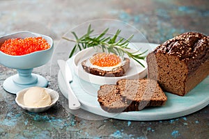 Homemade low carb loaf bread with traditional spices for black Borodino bread, Carnivore bread made from meat and eggs, served wit