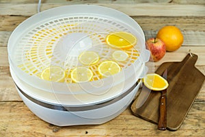 Homemade machine to dehydrate food with orange slices