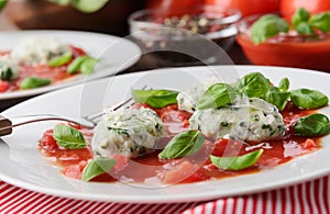 Homemade malfatti with tomato sauce