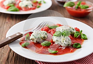 Homemade malfatti with tomato sauce