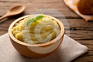 Homemade Mashed potatoes in wooden bowl,made from boiled potatoes mixed with butter and milk
