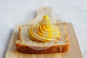 Homemade mayonnaise on a slice of integral bread photo