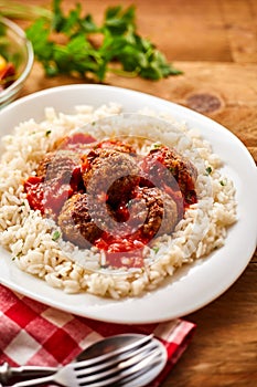 Homemade Meal of Saucy Meatballs on a Bed of Rice