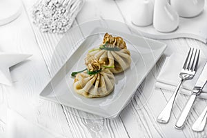 Homemade meat dumplings on a white plate