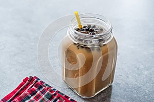 Homemade Milk Bubble Tea with Tapioca Pearls in Mason Jar.