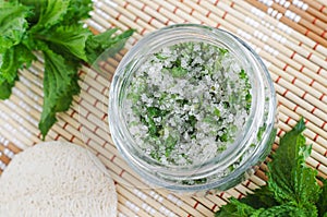 Homemade mint exfoliating scrub foot soak, bath salt with sugar, chopped mint leaves, olive oil end essential mint oil.