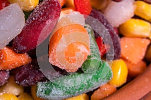 Homemade mixture of frozen vegetables, macro close-up background