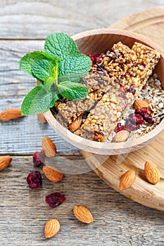 Homemade muesli bars in a wooden bowl.
