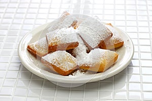 Homemade new orleans beignet donuts with plenty of powdered sugar