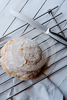 Homemade no knead bread over a cooling rack