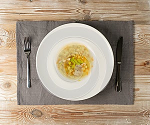 Homemade Noodle Soup with Chicken on Vintage Background photo