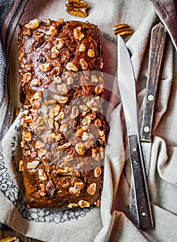 Homemade nut cake on wooden background