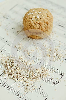 Homemade oatmeal cookies on vintage music sheet