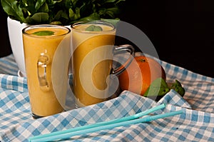 Homemade orange banana juice still life