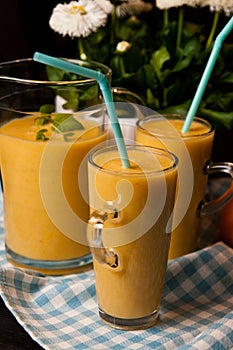 Homemade orange banana juice still life