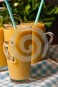 Homemade orange banana juice still life