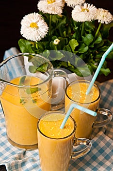 Homemade orange banana juice still life