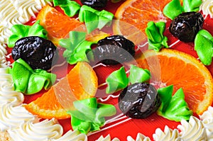 Homemade orange cake with slices oranges and prunes