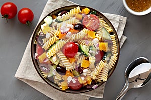 Homemade Organic Greek Pasta Salad in a Bowl, top view. Flat lay, overhead, from above