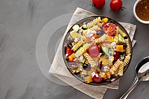 Homemade Organic Greek Pasta Salad in a Bowl, top view. Flat lay, overhead, from above. Copy space