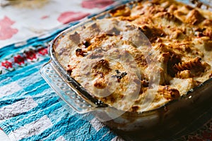 Homemade oven baked pasta casserole with fresh cheese. Traditional italian dish