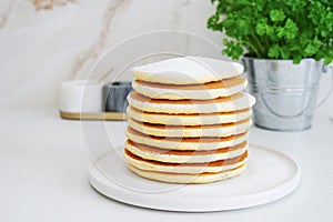 Homemade pancakes on white plate