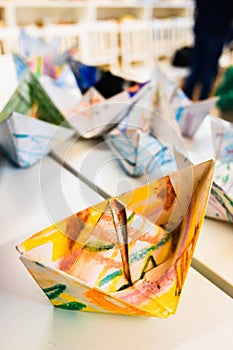 Homemade paper boats decorated with colors for children a day of crafts photo