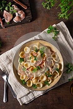 Homemade pasta with ham and garlic