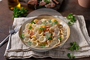 Homemade pasta with ham and garlic