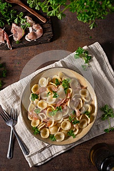 Homemade pasta with ham and garlic