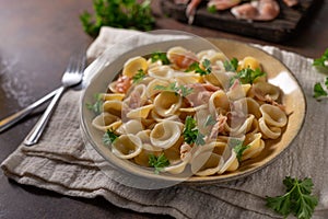 Homemade pasta with ham and garlic