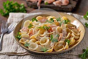 Homemade pasta with ham and garlic