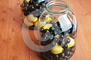 Homemade pear and plum billets in glass large jars on the table