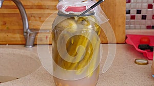 Homemade pickles are health, homemade summer pickles, maturing pickles in glass jars