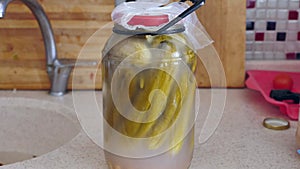 Homemade pickles are health, homemade summer pickles, maturing pickles in glass jars